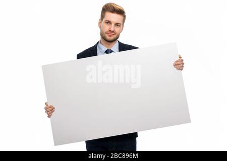 Business man holding white board Stock Photo