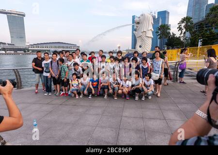 A Female Tourist Poses For A Photo In The Merlion Park, Singapore, South  East Asia Stock Photo - Alamy