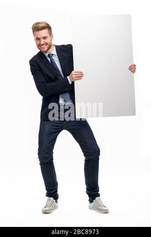 Business man holding white board Stock Photo
