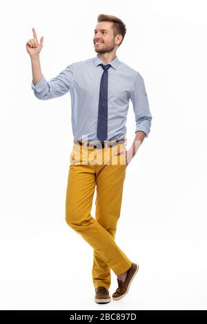 Portrait of young man standing on white background Stock Photo