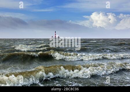 Lighthouse Westerheversand at Westerhever during high water spring tide / storm surge, Peninsula of Eiderstedt, Wadden Sea NP, North Frisia, Germany Stock Photo
