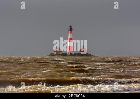 Lighthouse Westerheversand at Westerhever during high water spring tide / storm surge, Peninsula of Eiderstedt, Wadden Sea NP, North Frisia, Germany