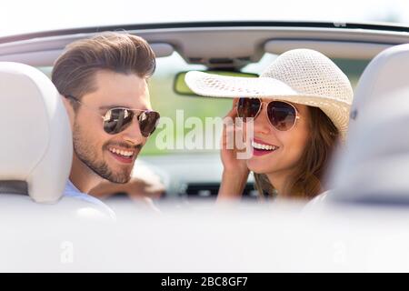 Couple enjoying a drive in a convertible Stock Photo