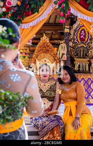 Vertical portrait of the bride and her friends at a Balinese wedding, Indonesia. Stock Photo