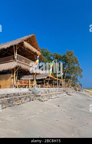 Asia, Indonesia, West Nusa Tenggara, Gili Air, Beachfront huts and Restaurant at Bambu Cottages (Resort) Stock Photo