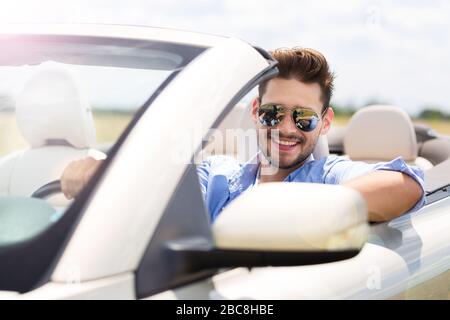 Man in convertible Stock Photo