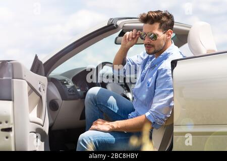 Man in convertible Stock Photo