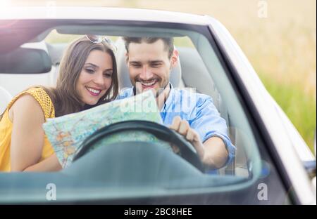 Couple enjoying a drive in a convertible Stock Photo