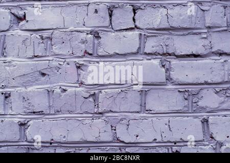Brick wall painted in violet color, background Stock Photo