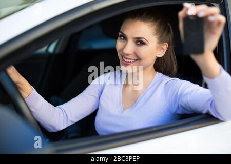 Young woman sitting in a car Stock Photo