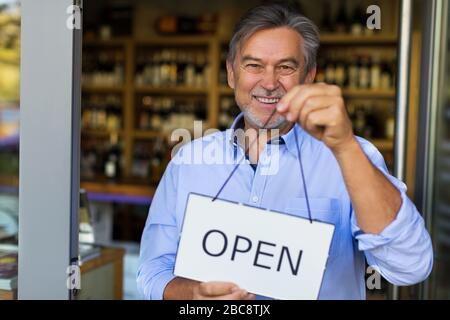 Man working in wine shop Stock Photo