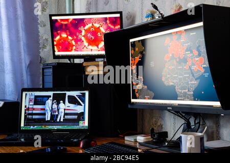 Krasnodar, Russia - April 02, 2020: Monitors with information about the coronavirus. From everywhere there is information about the coronavirus pandem Stock Photo