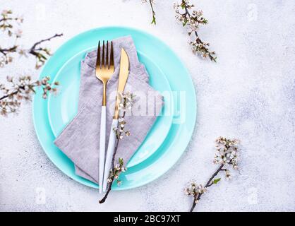 Spring table setting with blooming branch Stock Photo