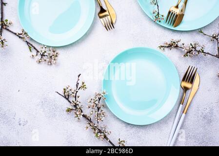 Spring table setting with blooming branch Stock Photo