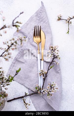 Spring table setting with blooming branch Stock Photo