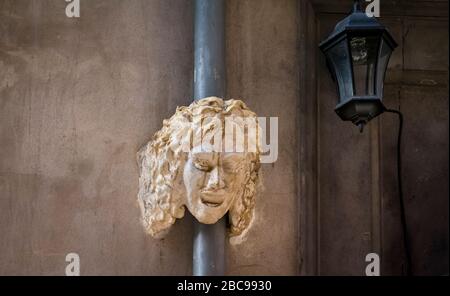 Mask and street lamp in Lyon in the Vieux Lyon district in autumn Stock Photo