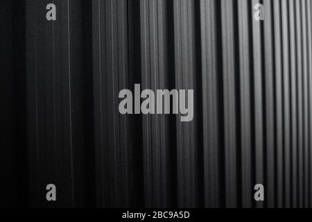 Black Corrugated metal sheet surface of the wall. Galvanize steel background. Stock Photo
