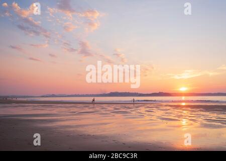 Peaceful sunset in the sand dunes of Loredo beach. Cantabria, Spain Stock Photo