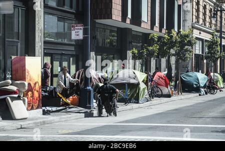 San Francisco, United States. 03rd Apr, 2020. Tents and homeless occupy the sidewalk on Eddy Street in the Tenderloin district of San Francisco on Friday, April 3, 2020. San Francisco is trying to spread out their homeless to avoid the coronavirus. Photo by Terry Schmitt/UPI Credit: UPI/Alamy Live News Stock Photo