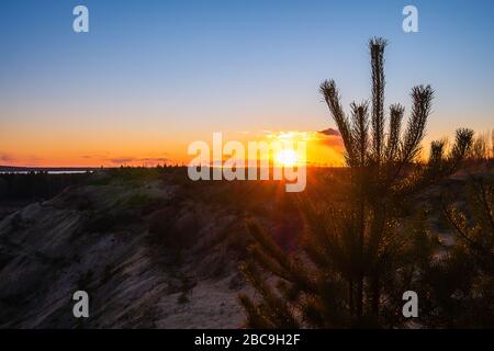 Sunset against the backdrop of large obese clouds.  Stock Photo