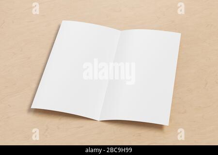Blank square leaflet on wooden background. Bi-fold or half-fold opened brochure isolated with clipping path. Side view Stock Photo