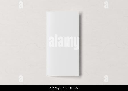 Blank square leaflet on white wooden background. Bi-fold or half-fold closed brochure isolated with clipping path. View directly above. 3d illustratio Stock Photo