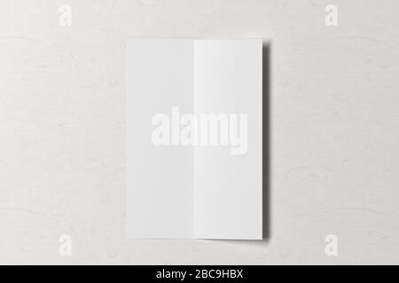 Blank vertical A4 leaflet on white wooden background. Bi-fold or half-fold opened brochure isolated with clipping path. View directly above. 3d illust Stock Photo