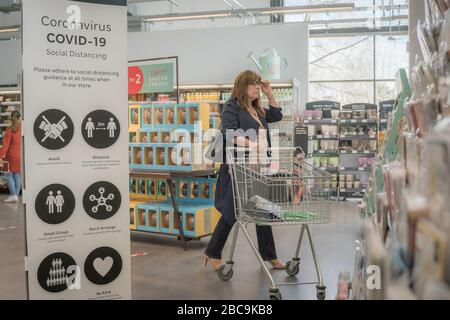 Crawley, UK - April 3, 2020 - social distancing instructions in a supermarket hall to stop coronovirus spread Stock Photo