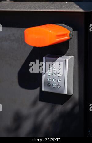 Black wall with modern intercom outdoors Stock Photo - Alamy