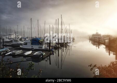 Sails in the fog. Spring foggy morning in Vancouver, Canada Stock Photo