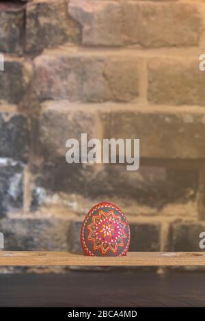 Sorbian Easter eggs, wax batik technique, seventh step: further patterns were applied to the egg with a quill. The Sorbs use hot wax for this. Stock Photo