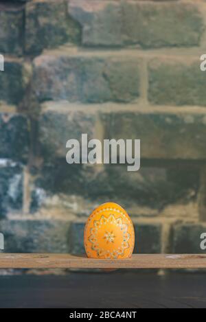 Sorbian Easter eggs, wax batik technique, fifth step: After a first color bath, the first patterns can be seen on the chicken egg. Stock Photo