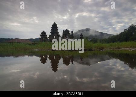 Tamblingan lake at high tide and cloudy weather Stock Photo