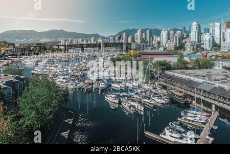 Beautiful city of Vancouver during summer. So many boats, sails, nice modern buildings, ocean and mountains. Stock Photo