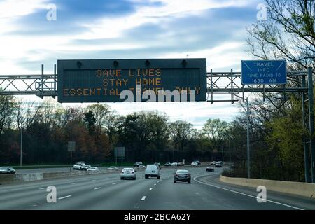 Covid 19 warning sign on Washington DC Capitol Beltway Telling people to stay home save lives Stock Photo