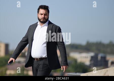 Armenian business man in Yerevan Cascade, Armenia Stock Photo