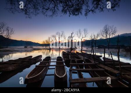 lake tamblingan  when sunrise and traditional boat Stock Photo