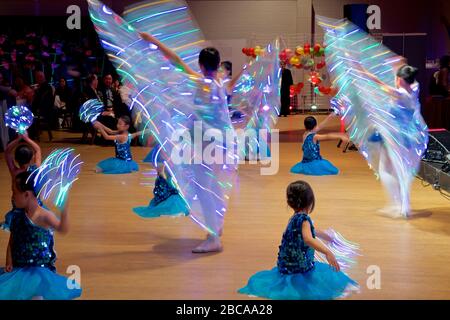 Motion blur of dancing by teenagers on Mid Autumn Moon Festival at Toronto Chinese Community Centre Stock Photo