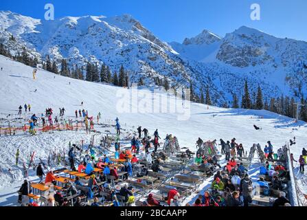 Sun terrace of the restaurant of the Rosshütte against Reither Spitze (2374m), Seefeld, Tyrol, Austria Stock Photo