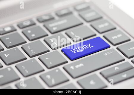 Work from home concept shown on close up enter key on notebook keyboard Stock Photo