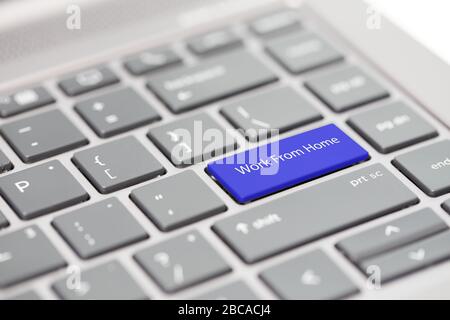 Work from home concept shown on close up enter key on notebook keyboard Stock Photo