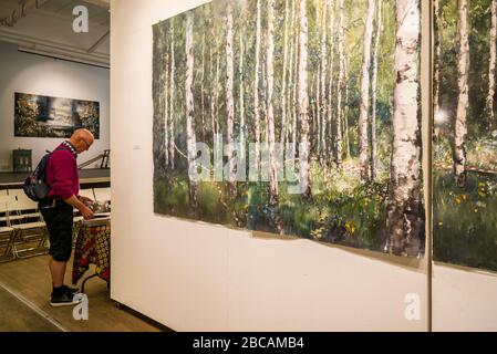 Sweden, Varmland, Karlstad, Sandgrund Karlstad, former dancehall now a gallery for famed Swedish artist Lars Lerin, interior with visitors, Stock Photo