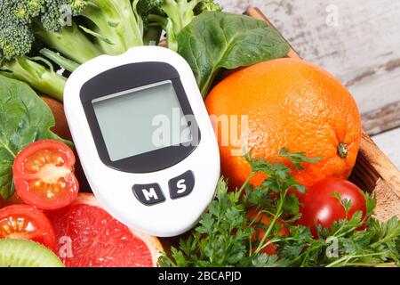 Glucose meter with result of sugar level, blood pressure monitor and fresh  fruits with vegetables, healthy lifestyle, diabetes and prevention of hyper  Stock Photo - Alamy