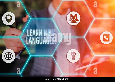 Writing note showing Learn New Languages. Business concept for developing ability to communicate in foreign language Stock Photo
