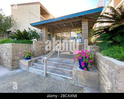 Gate door entrance of typical condo complex community. in Solana Beach, San Diego, California, USA. March 20th, 2019 Stock Photo