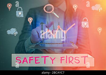 Handwriting text writing Safety First. Conceptual photo used to say that the most important thing is to be safe Stock Photo