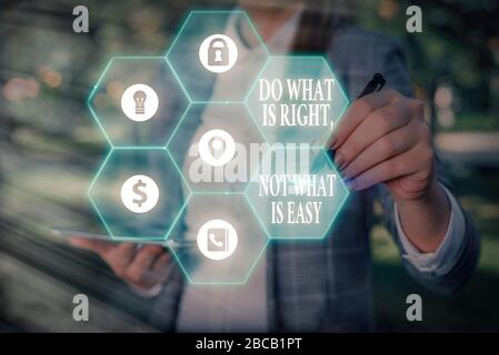 Writing note showing Do What Is Right Not What Is Easy. Business concept for willing to stand up for what is right Stock Photo