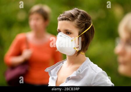 Close up of a coronavirus mask worn by a young woman Stock Photo