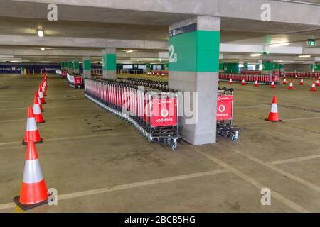 Sydney, Australia. 04th Apr, 2020. As the Australian airline industry faces an increasingly uncertain future as a result of the impact of the COVID-19 Coronavirus, the carpark at Sydney International Airport has become empty of air travellers and their cars and holds hundreds of now un-needed passenger baggage trolleys. Credit: Robert Wallace/Alamy Live News Stock Photo