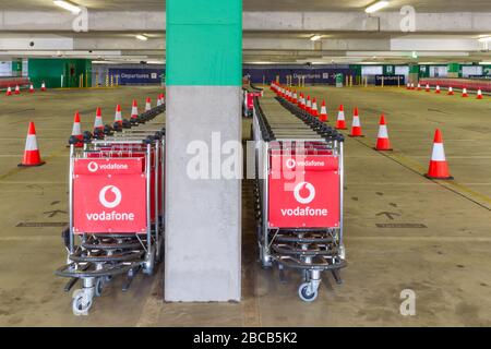 Sydney, Australia. 04th Apr, 2020. As the Australian airline industry faces an increasingly uncertain future as a result of the impact of the COVID-19 Coronavirus, the carpark at Sydney International Airport has become empty of air travellers and their cars and holds hundreds of now un-needed passenger baggage trolleys. Credit: Robert Wallace/Alamy Live News Stock Photo